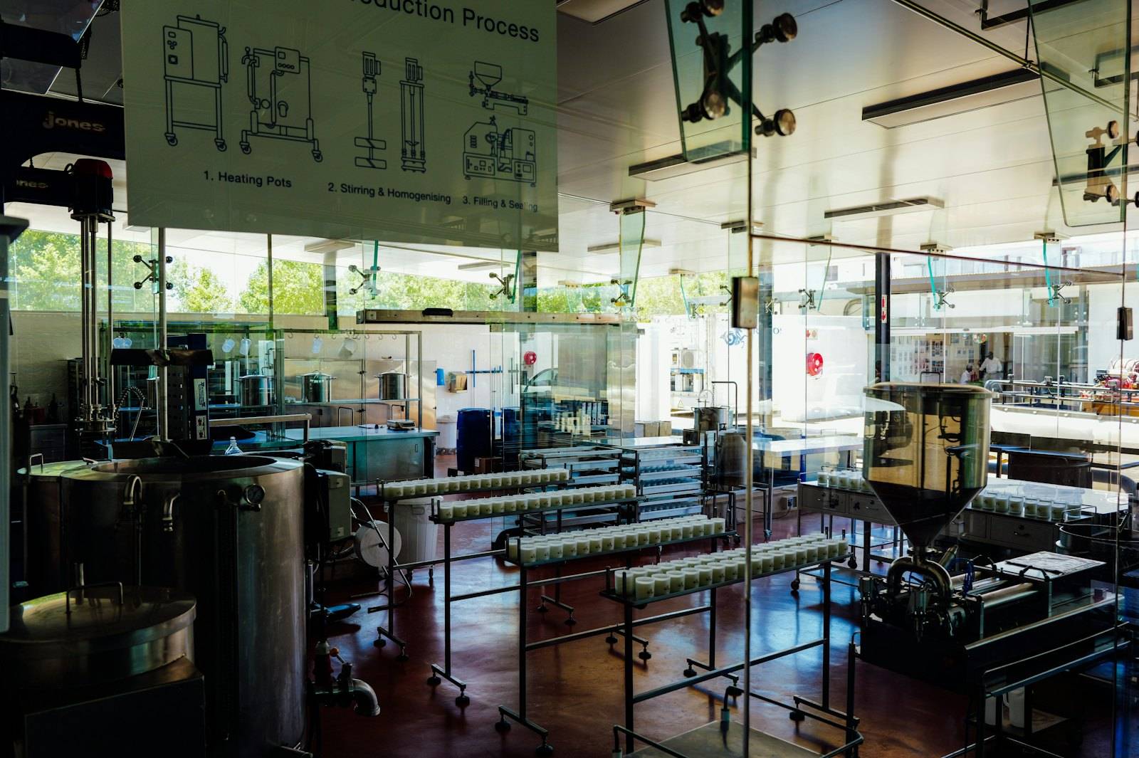 Stainless steel tanks, pipework and processing equipment in a bright production hall
